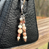 Butterfly Charm with Copper Accents
Handmade butterfly charm featuring gemstone and Czech beads with elegant copper findings, perfect for purses or zippers.