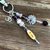 Purple Yoga-themed beaded charm with calming accents, perfect for purses, backpacks, or luggage.