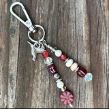 Red Hummingbird Charm
Vibrant red beaded charm featuring a hummingbird and premium gemstone accents, ideal for accessorizing purses or backpacks.