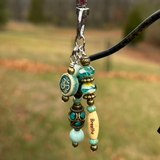 beautiful yoga purse dangle with breathe bead and aum charm in a blue turquoise color with amazonite gemstones