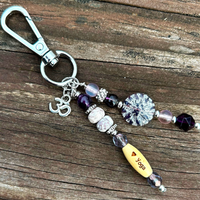 purple yoga purse decor with a love yoga theme and an aum charm for bags, keychains, luggage